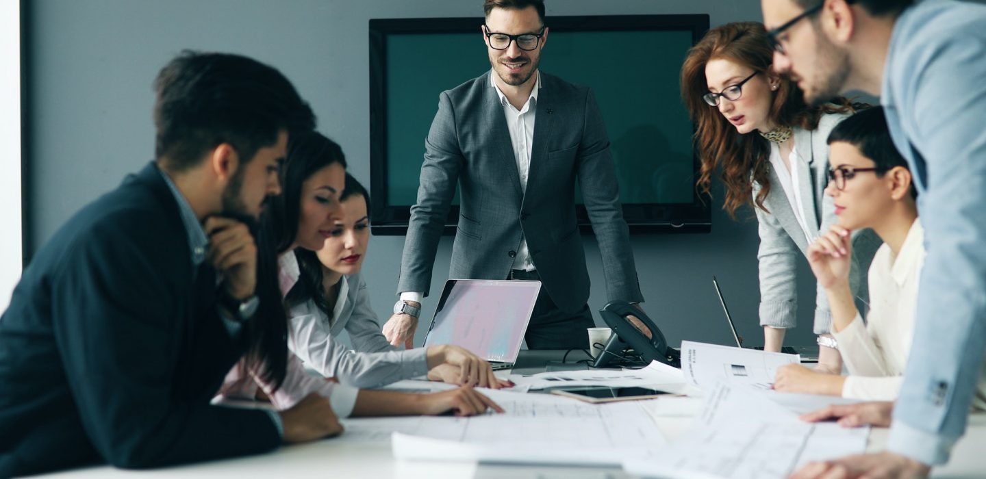 Corporate teamworking colleagues in modern office